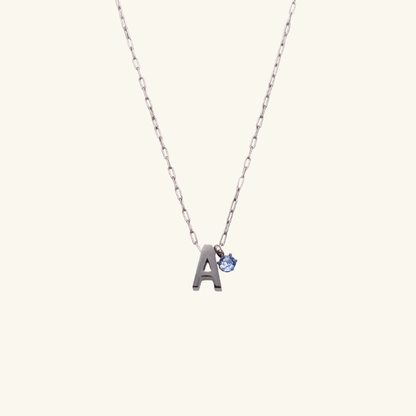 Personalized initial necklace featuring a Swarovski crystal charm on a delicate 1 mm chain, in gold and silver, hypoallergenic and tarnish-resistant.