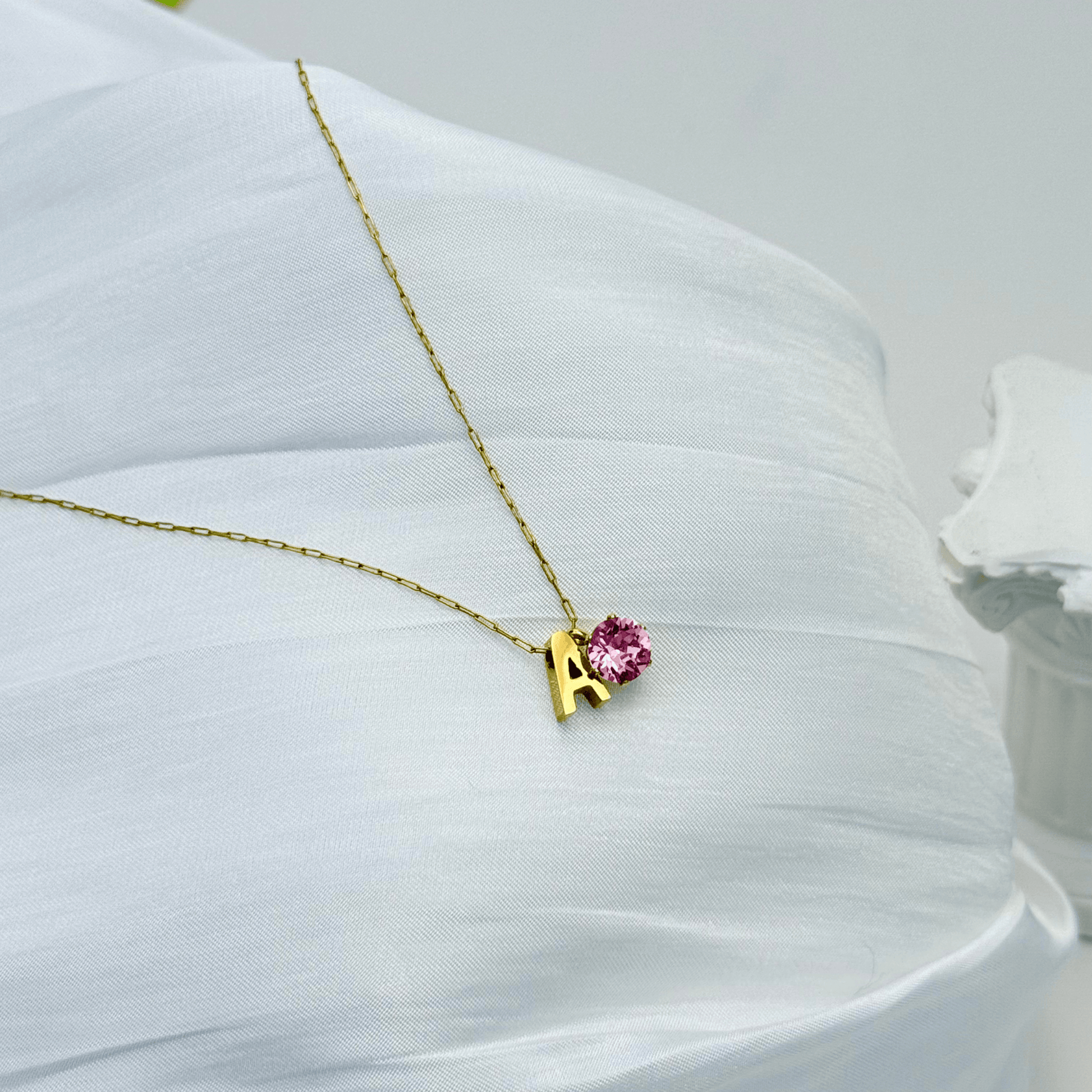 Personalised initial necklace featuring a Swarovski crystal charm on a delicate 1 mm chain, in gold and silver, hypoallergenic and tarnish-resistant.