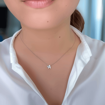 Personalized initial necklace featuring a Swarovski crystal charm on a delicate 1 mm chain, in gold and silver, hypoallergenic and tarnish-resistant.
