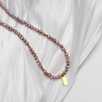 Custom purple pearl necklace with engravable charm in gold or silver – waterproof personalised jewellery.