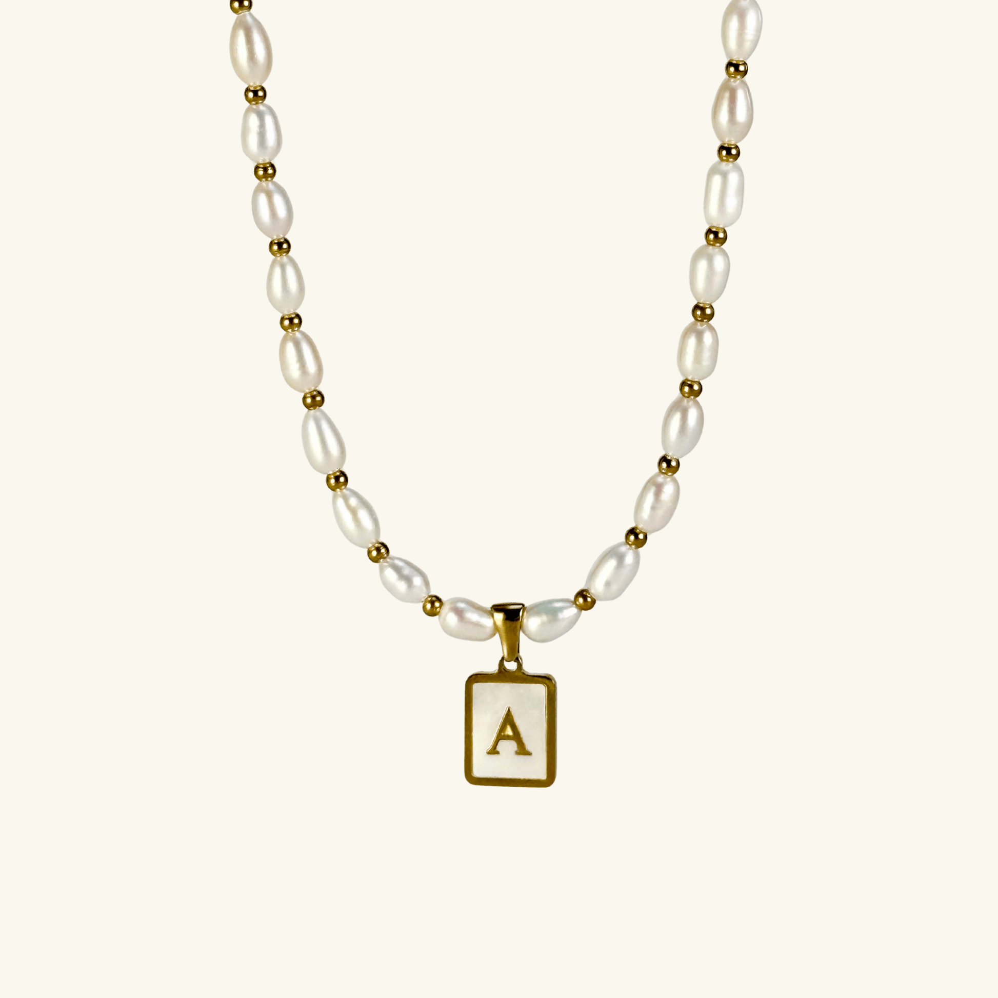 Custom freshwater pearl necklace with gold shell initial pendant