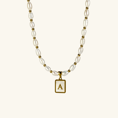 Custom freshwater pearl necklace with gold shell initial pendant