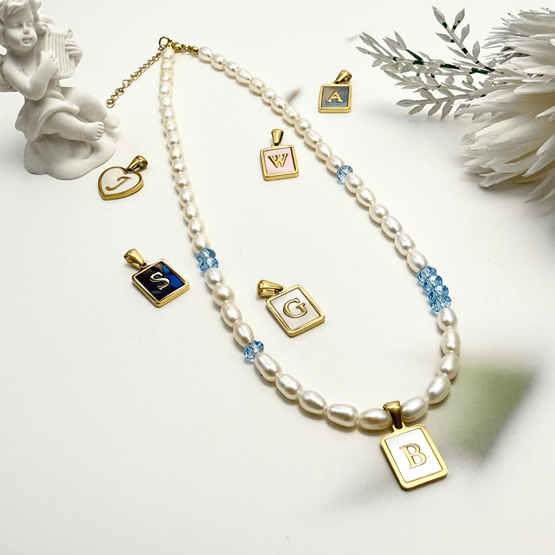 Custom freshwater pearl necklace with Swarovski birthstone and shell initial charm
