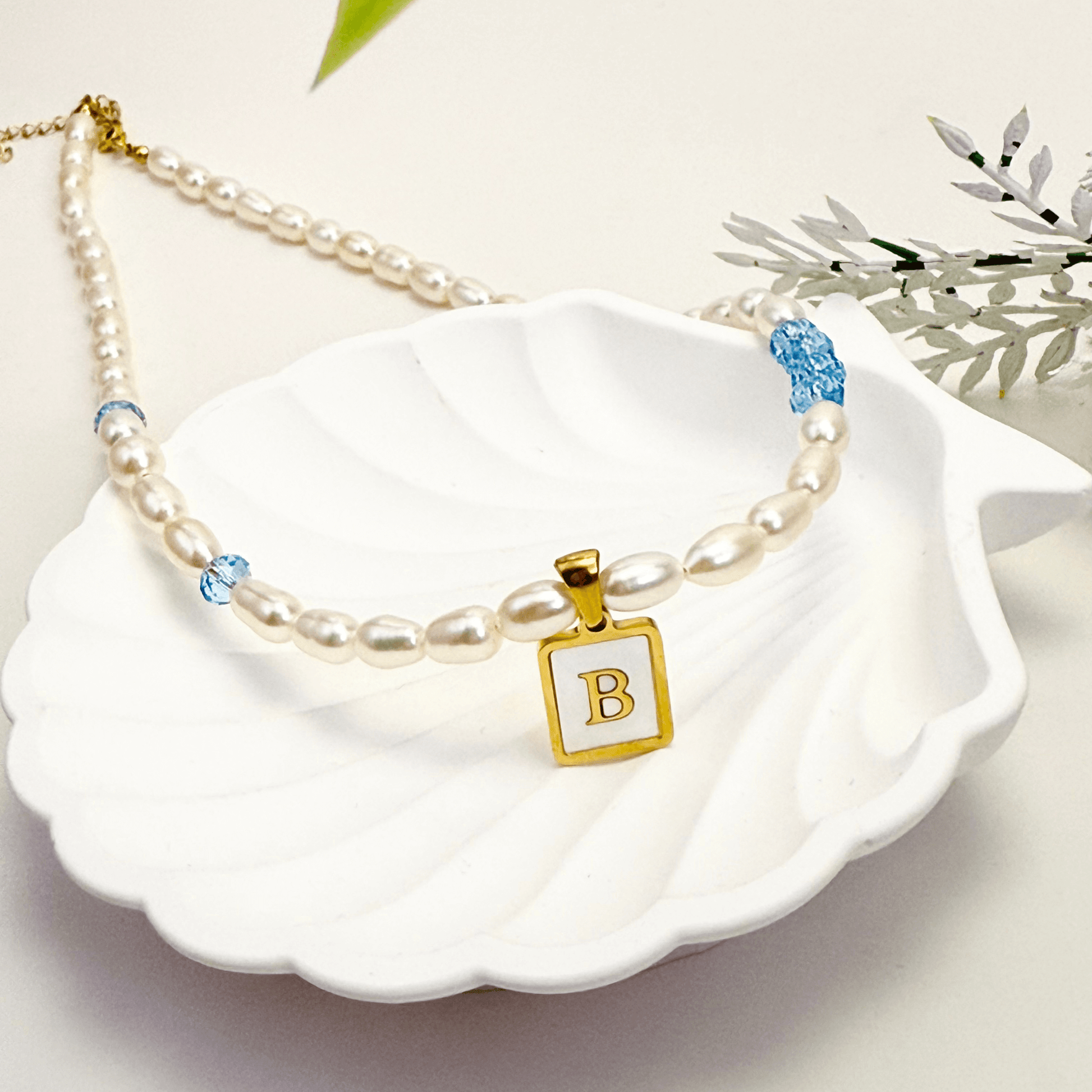 Custom freshwater pearl necklace with Swarovski birthstone and shell initial charm