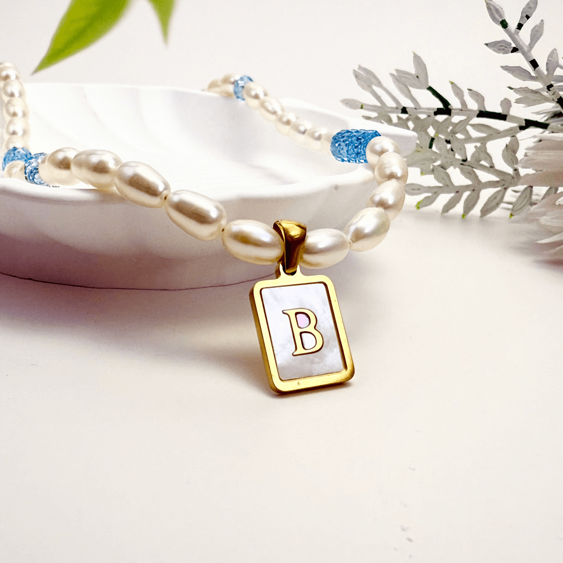 Custom freshwater pearl necklace with Swarovski birthstone and shell initial charm