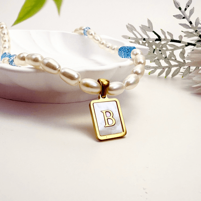 Custom freshwater pearl necklace with Swarovski birthstone and shell initial charm