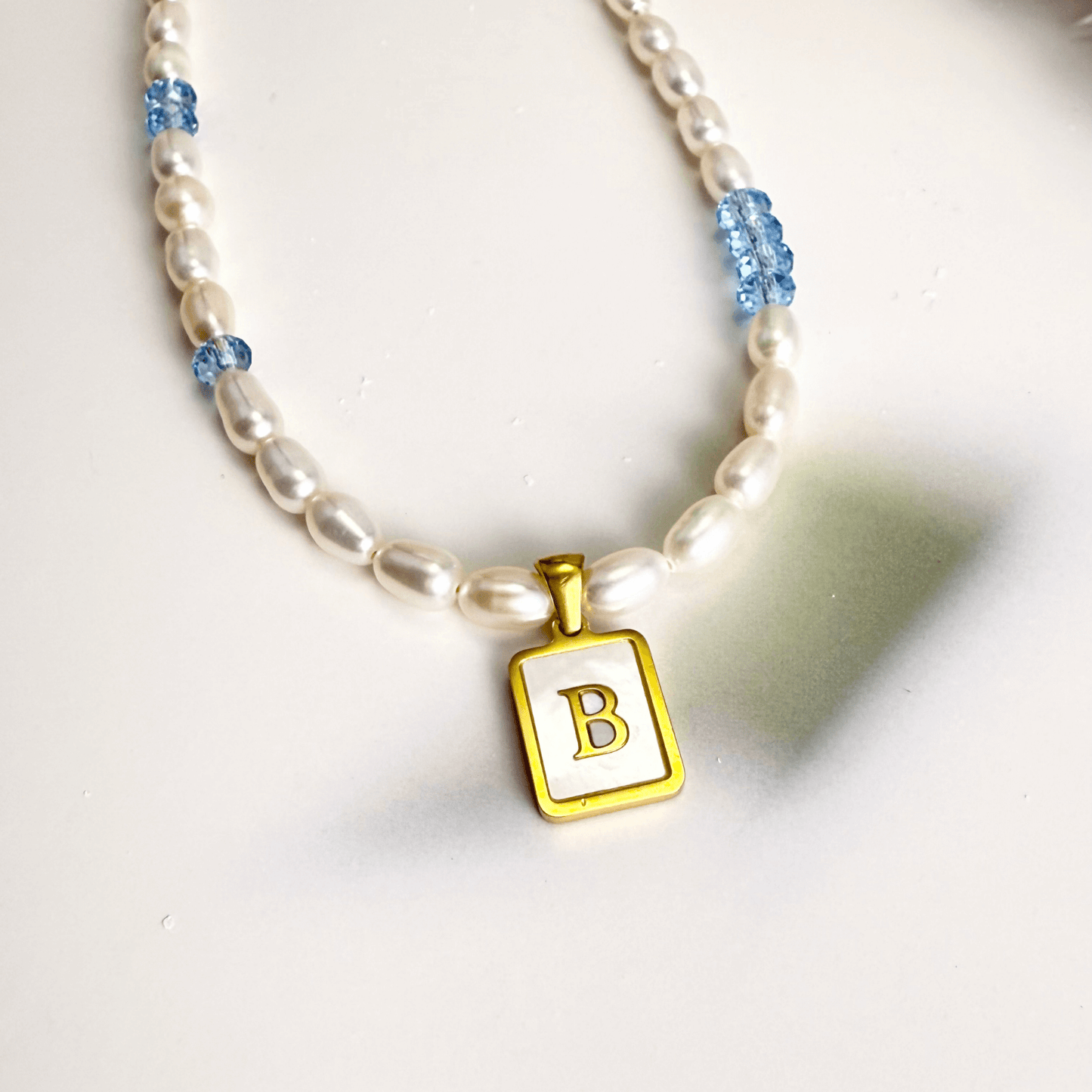 Custom freshwater pearl necklace with Swarovski birthstone and shell initial charm