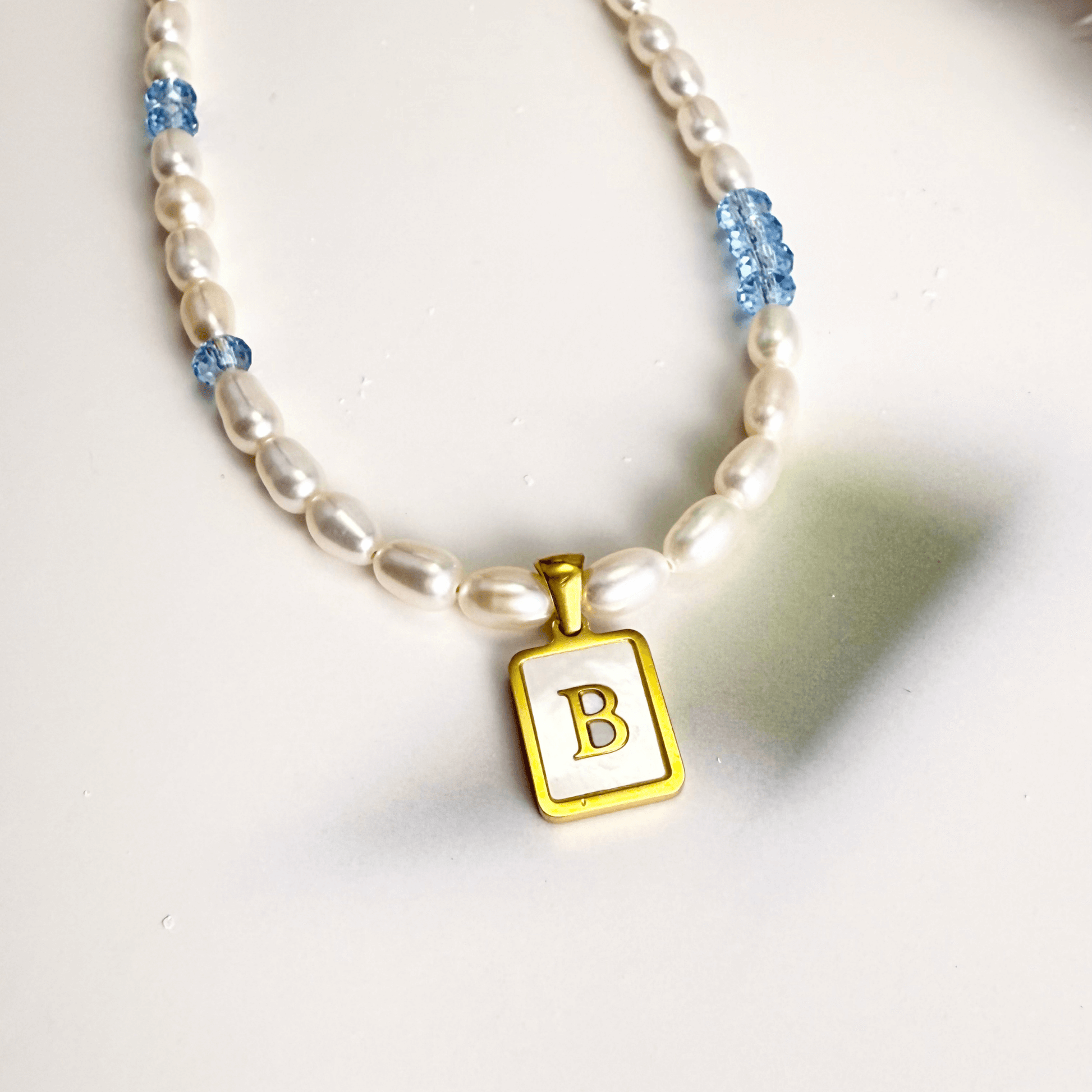 Custom freshwater pearl necklace with Swarovski birthstone and shell initial charm