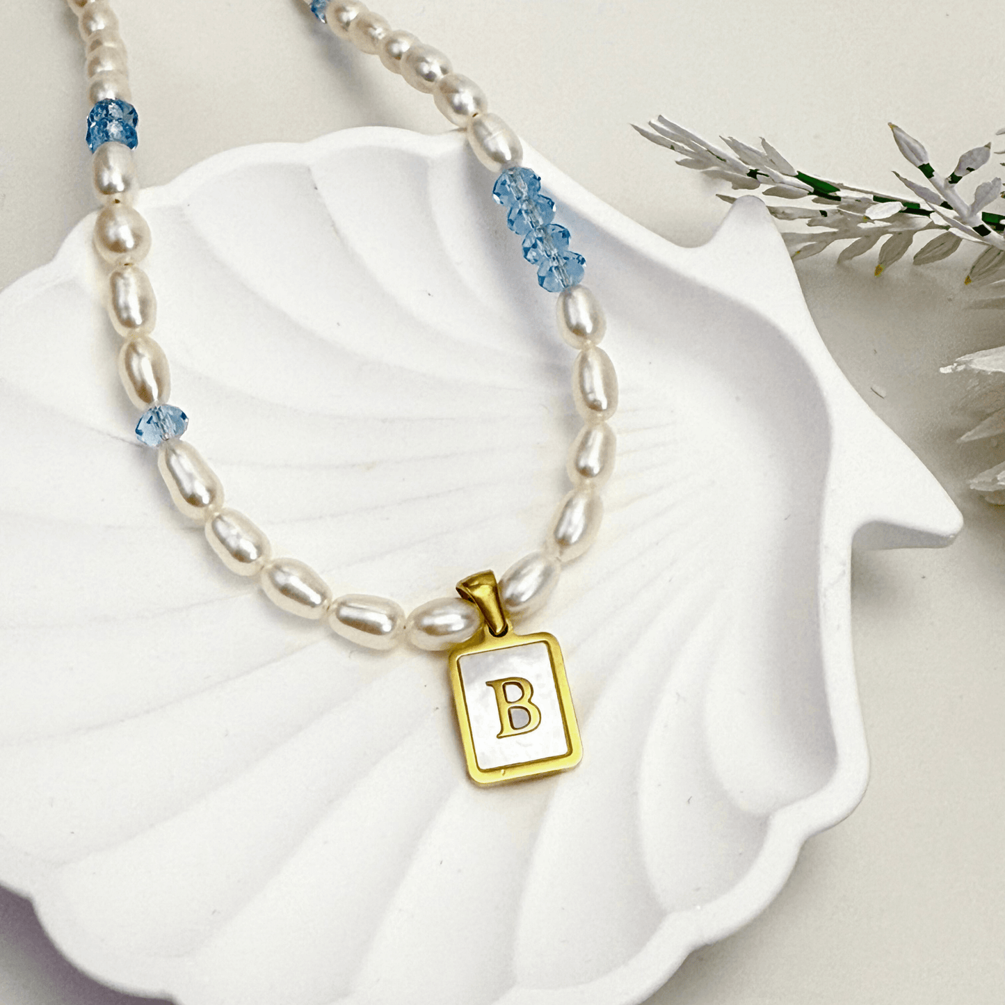 Custom freshwater pearl necklace with Swarovski birthstone and shell initial charm