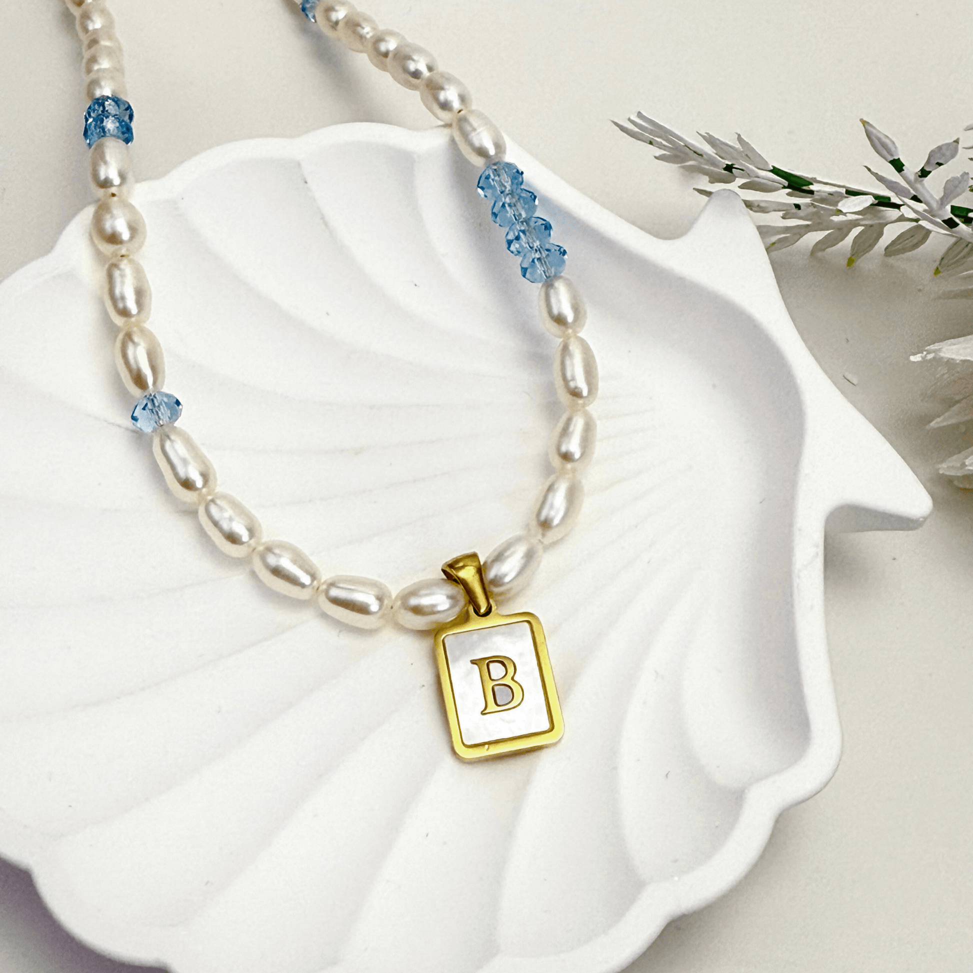 Custom freshwater pearl necklace with Swarovski birthstone and shell initial charm