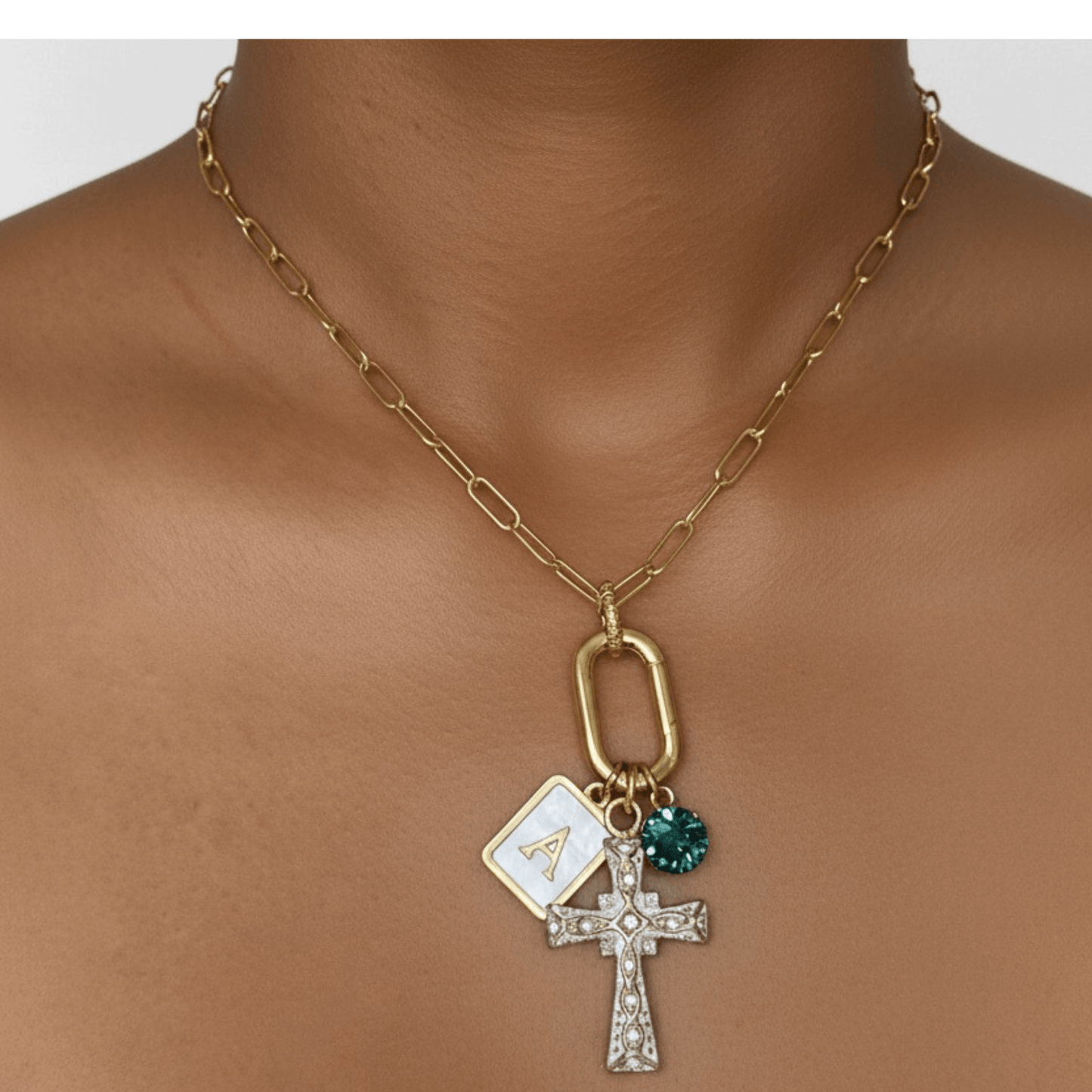 Custom openable link necklace with gold cross pendant, shell initial charm, and teal birthstone made with Swarovski® element on waterproof chain