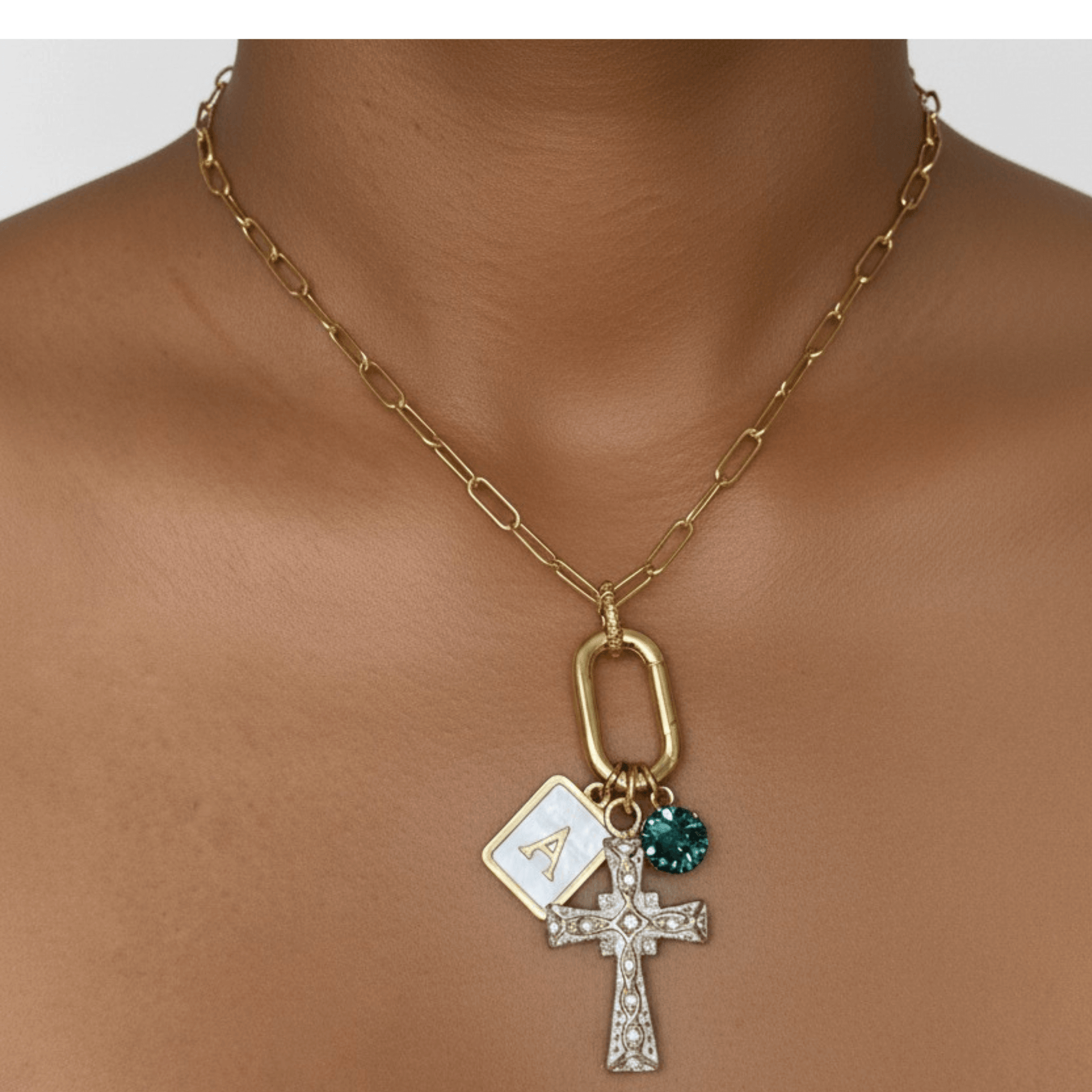 Custom openable link necklace with gold cross pendant, shell initial charm, and teal birthstone made with Swarovski® element on waterproof chain