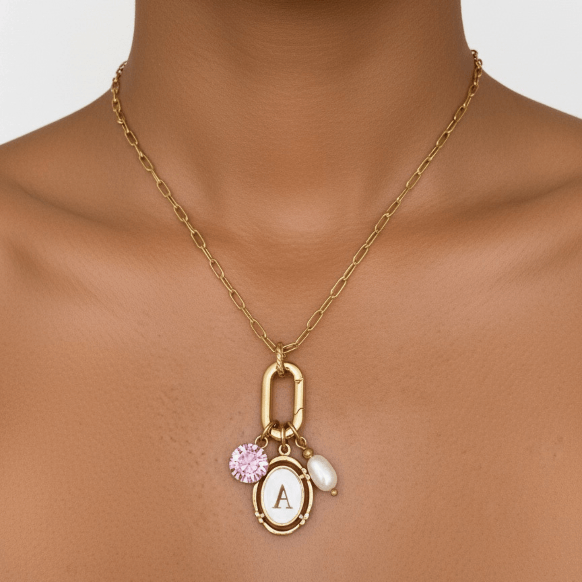 Gold openable link charm necklace with pink Swarovski birthstone and freshwater pearl on waterproof chain, customisable to add any charms
