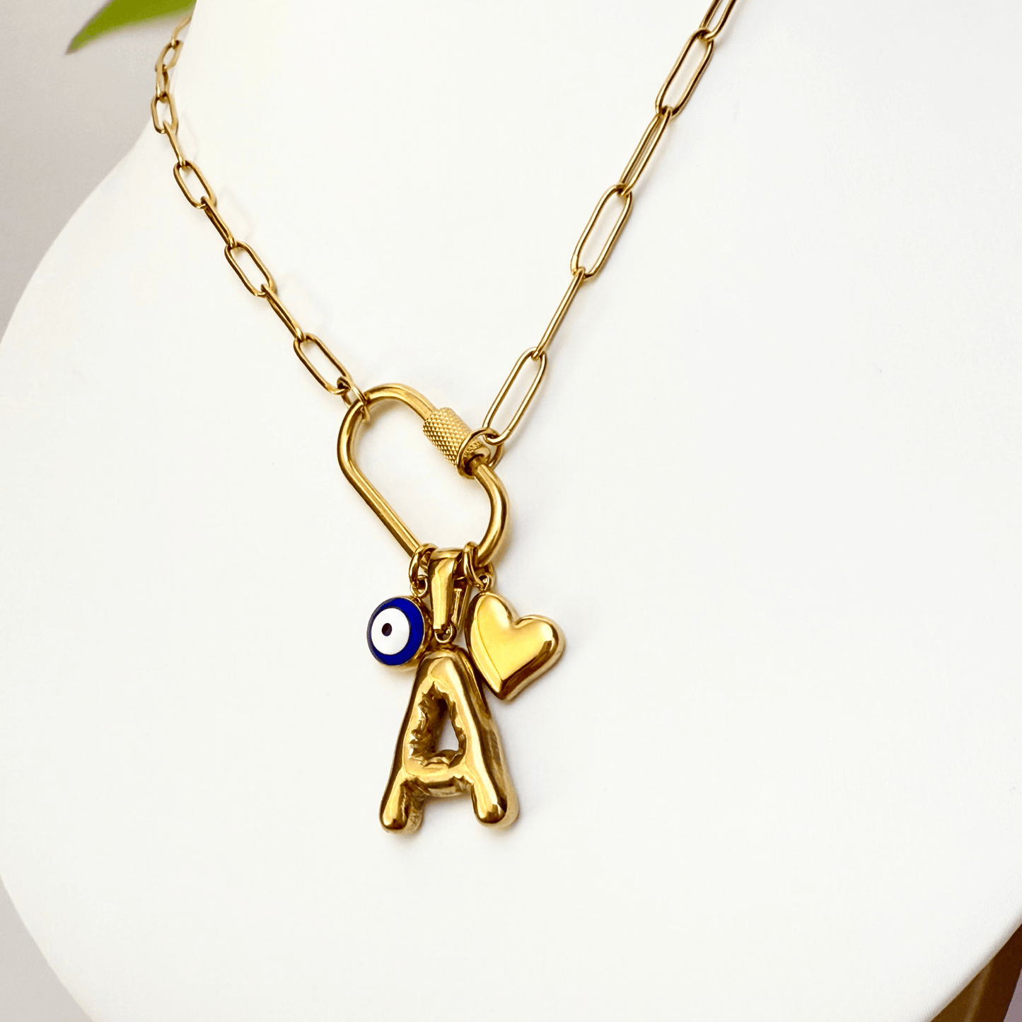 Custom rectangular ring necklace with detachable charms – initial, evil eye, and heart for love and protection.