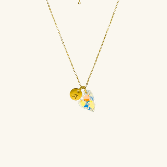Engraved disc and Swarovski heart necklace in gold and silver