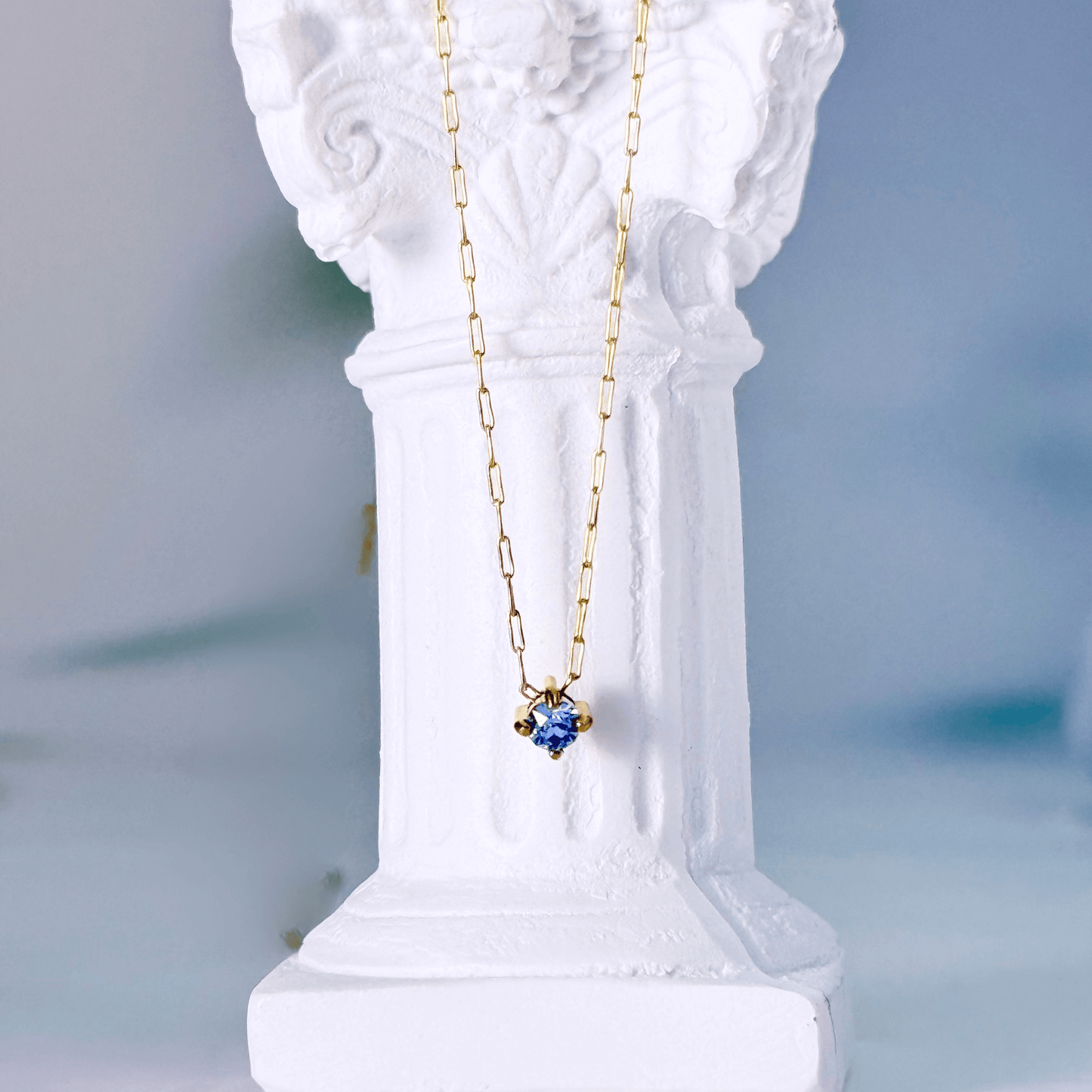 Dainty gold birthstone necklace with sparkling Swarovski element, minimalist and elegant design for everyday wear.