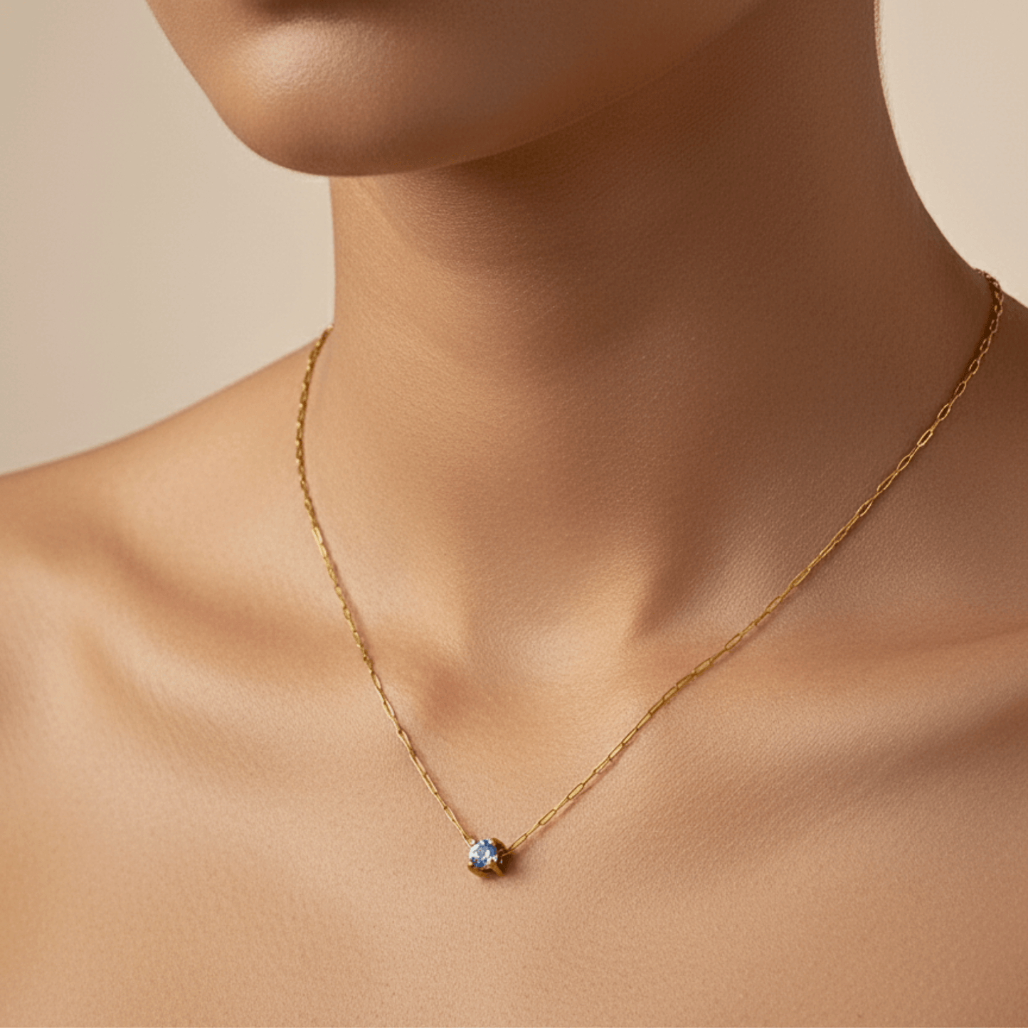 Dainty gold birthstone necklace with sparkling Swarovski element, minimalist and elegant design for everyday wear.