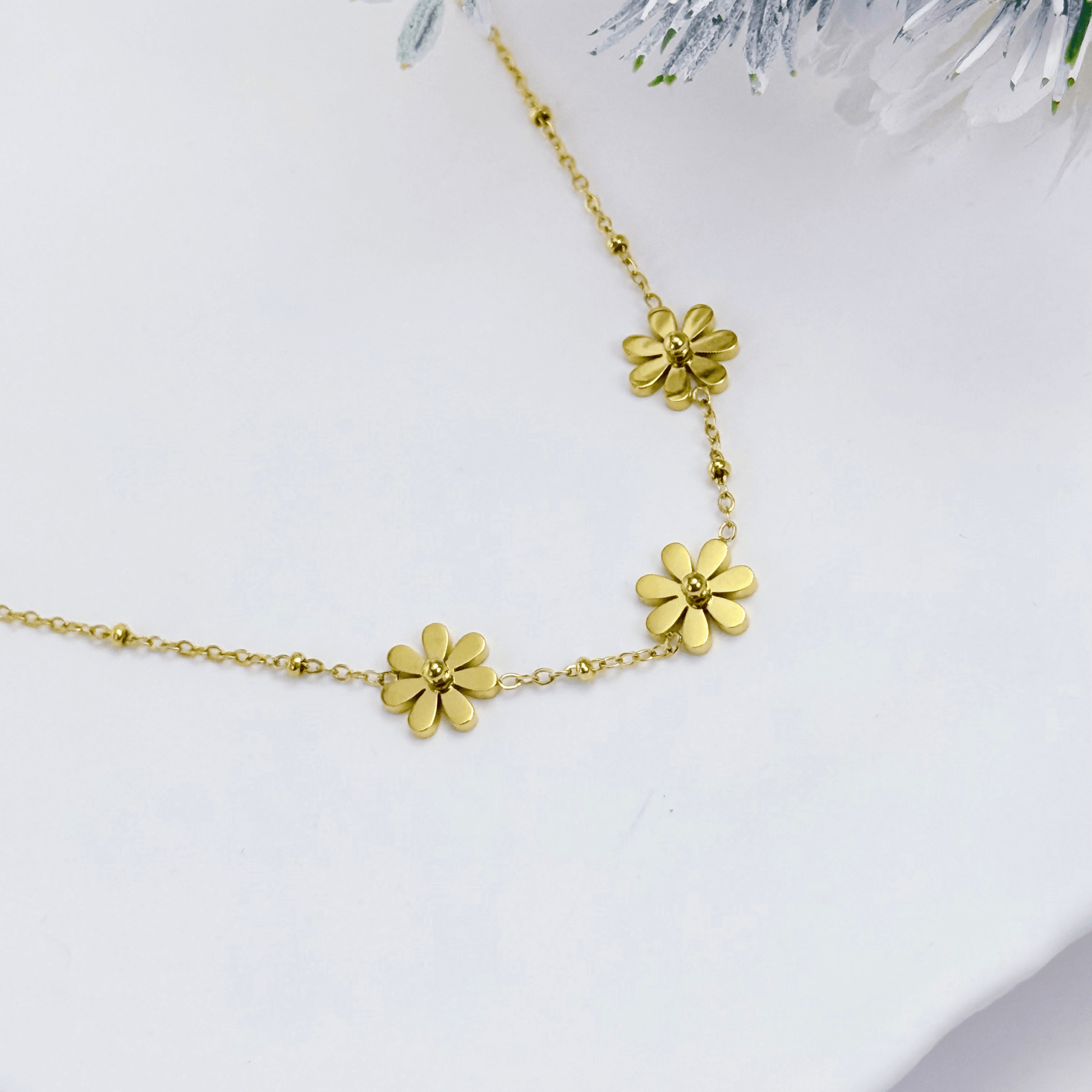 Gold daisy floral charm necklace with beaded chain, waterproof and tarnish-resistant.