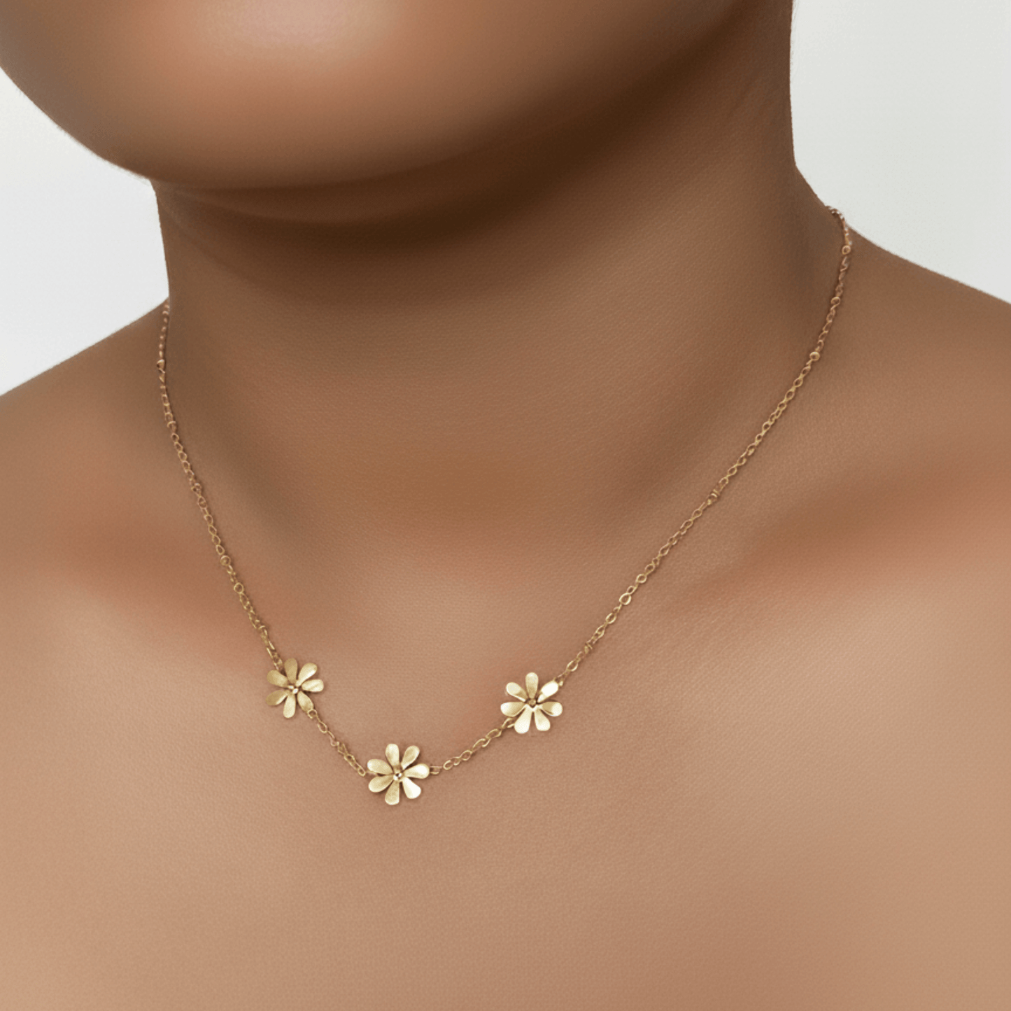 Gold daisy floral charm necklace with beaded chain, waterproof and tarnish-resistant.
