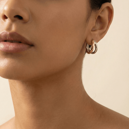 Dual-tone gold and silver huggie earrings with polished modern design