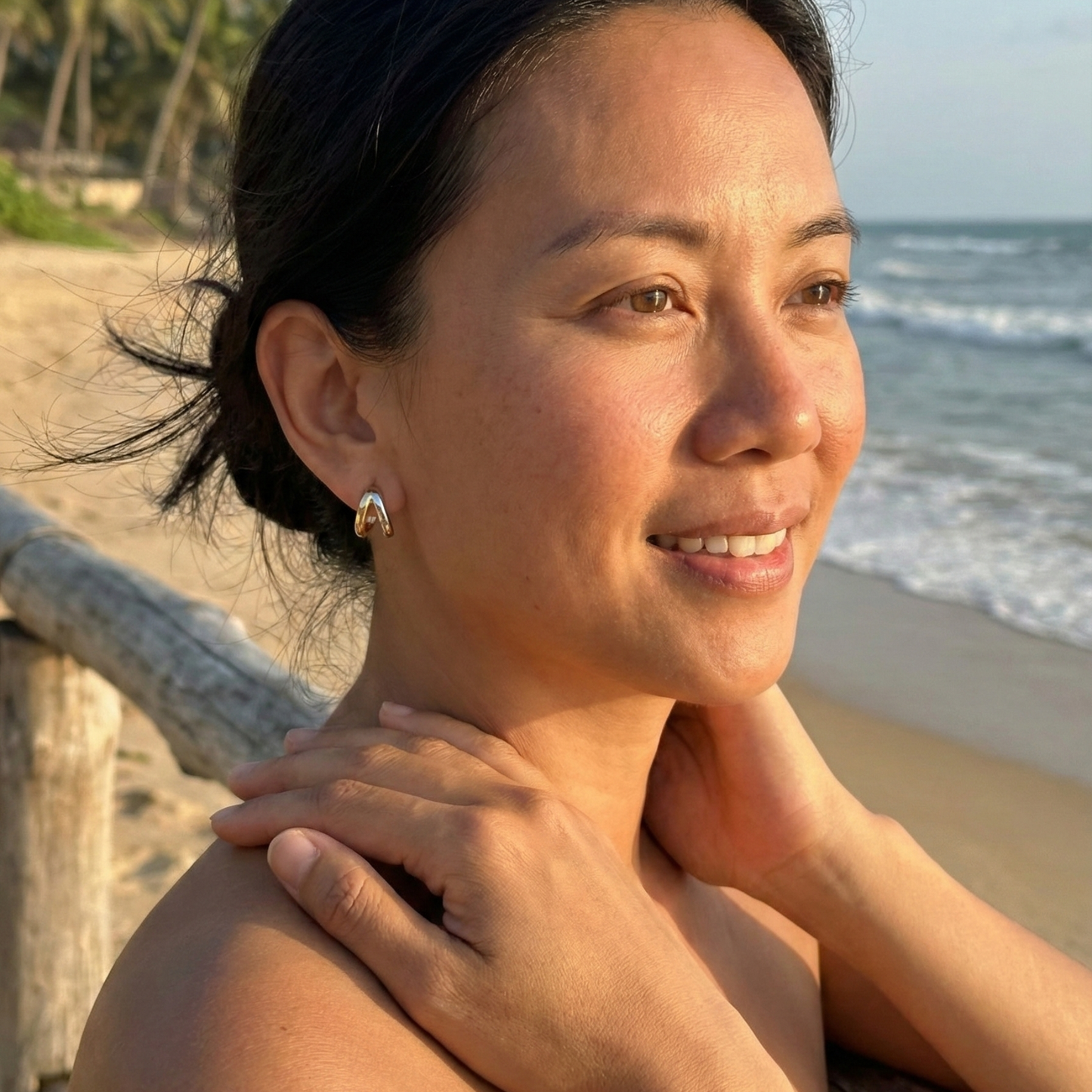 Dual-tone gold and silver huggie earrings with polished modern design