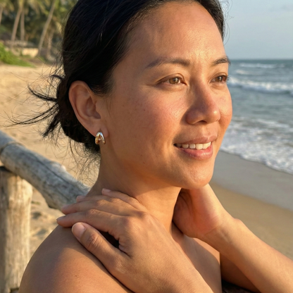 Dual-tone gold and silver huggie earrings with polished modern design