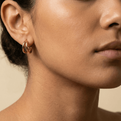 Double gold huggie earrings with layered hoop design