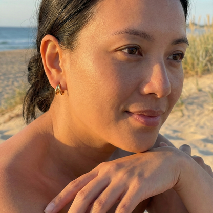 Double gold huggie earrings with layered hoop design