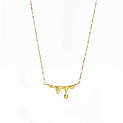 Gold drip-style pendant necklace with a sleek molten design on a fine chain,