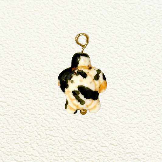 Brown and cream patterned synthetic stone turtle charm resembling natural jasper, with gold loop