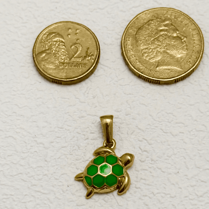 Small gold turtle charm with bright green hexagon-patterned enamel shell, lightweight and playful, perfect for ocean-themed jewellery designs