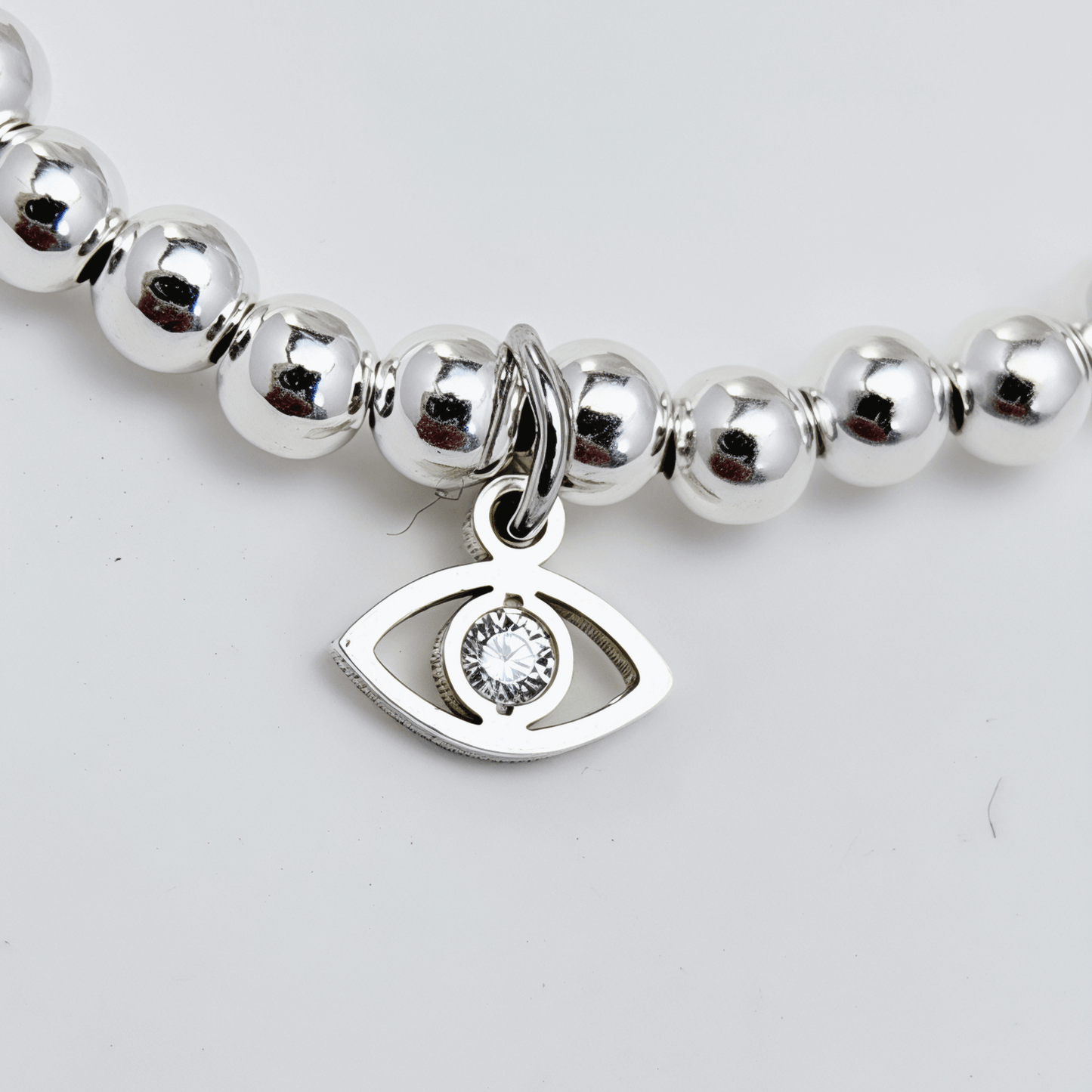 Evil eye charm sterling silver bead bracelet with crystal detail and polished silver beads – MXW Jewellery