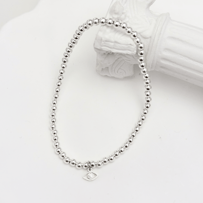 Evil eye charm sterling silver bead bracelet with crystal detail and polished silver beads – MXW Jewellery