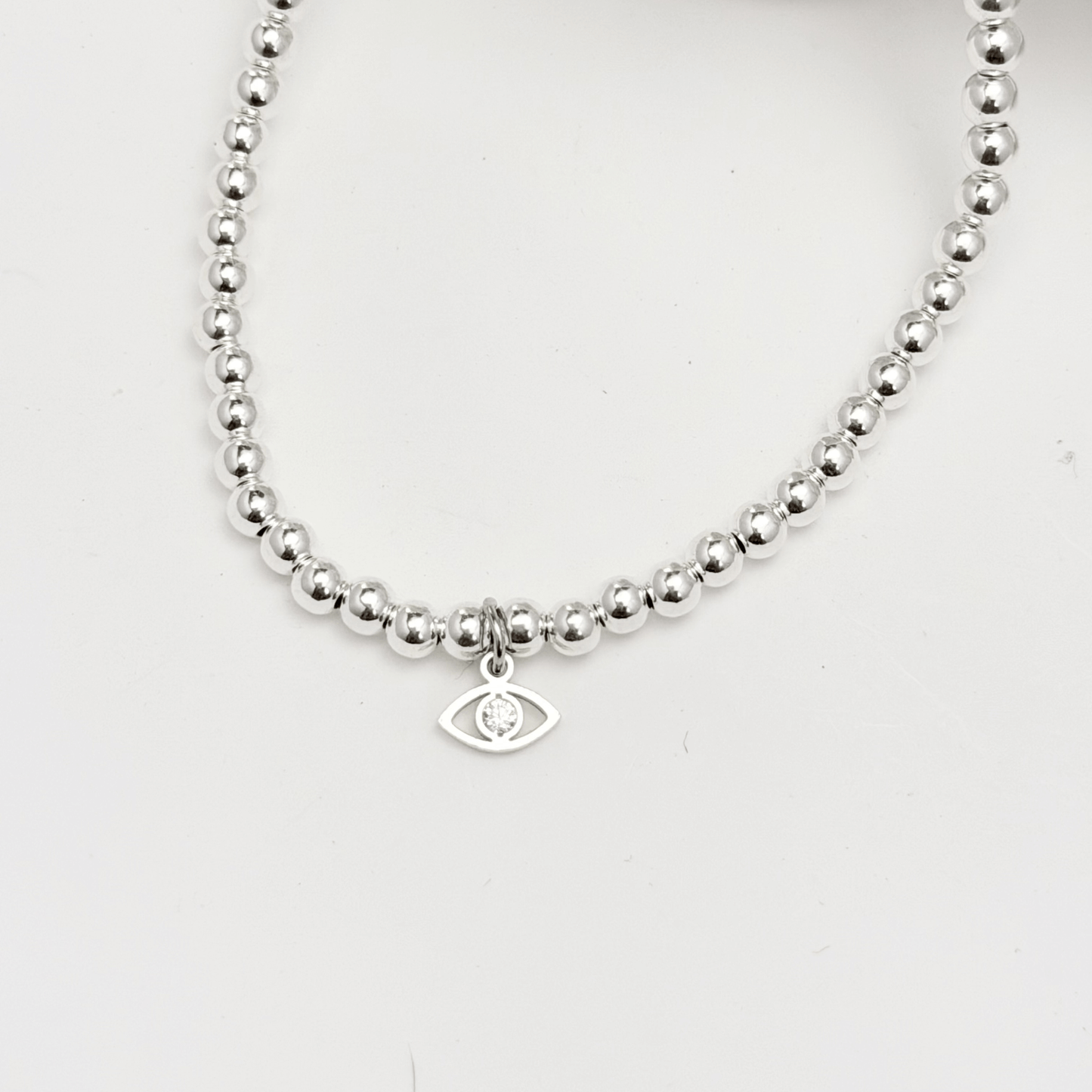 Evil eye charm sterling silver bead bracelet with crystal detail and polished silver beads – MXW Jewellery