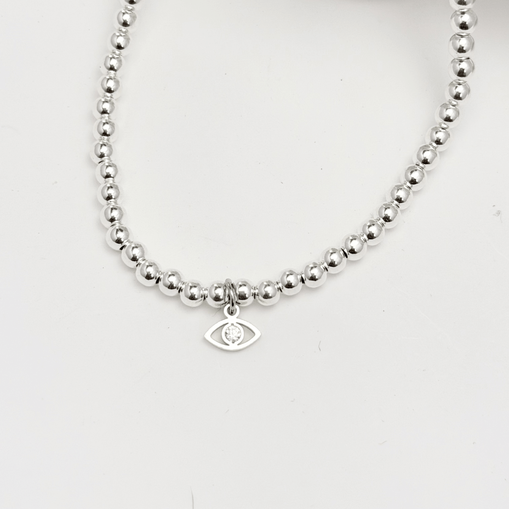 Evil eye charm sterling silver bead bracelet with crystal detail and polished silver beads – MXW Jewellery