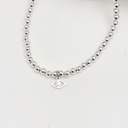 Evil eye charm sterling silver bead bracelet with crystal detail and polished silver beads – MXW Jewellery