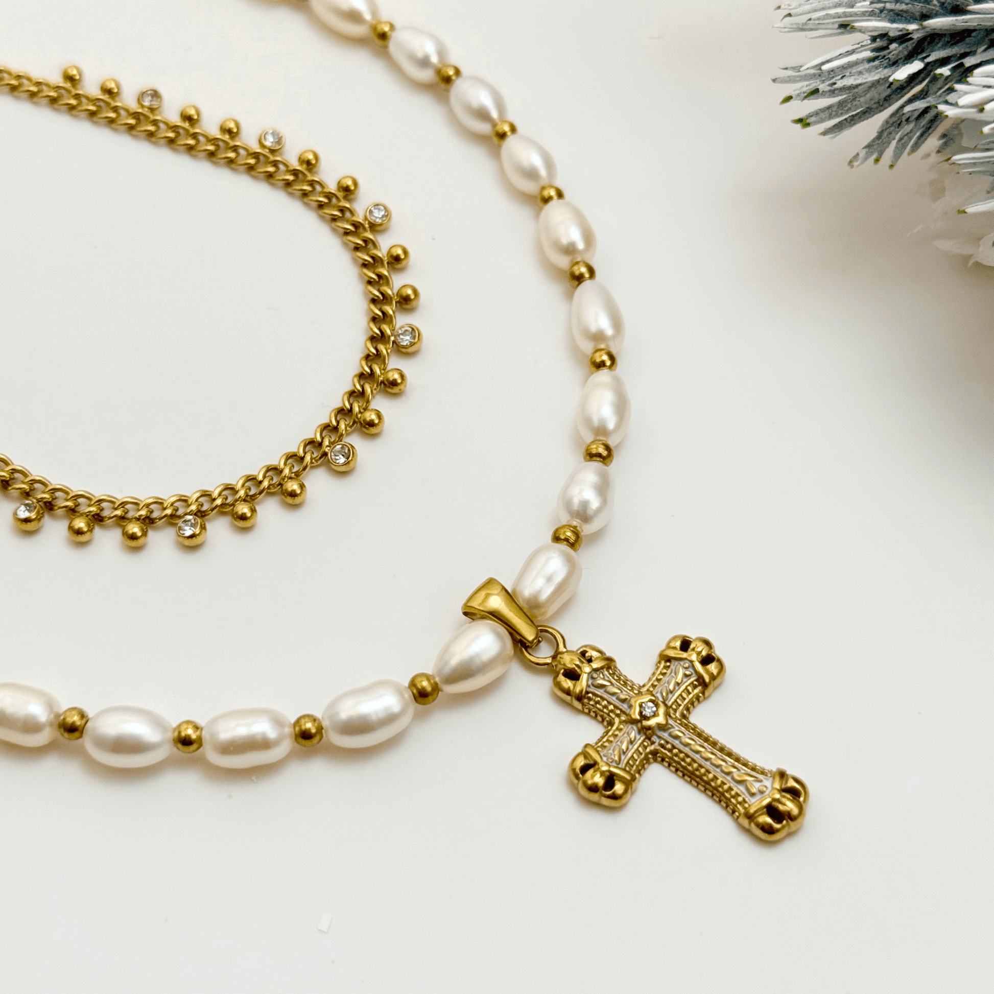 Layered pearl cross necklace set with freshwater pearls and gold zircon chain