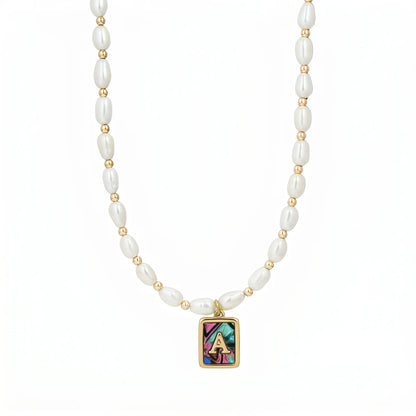 Premium freshwater rice pearl and 14K gold filled beaded necklace with personalised abalone shell initial charm, hand-finished in Australia