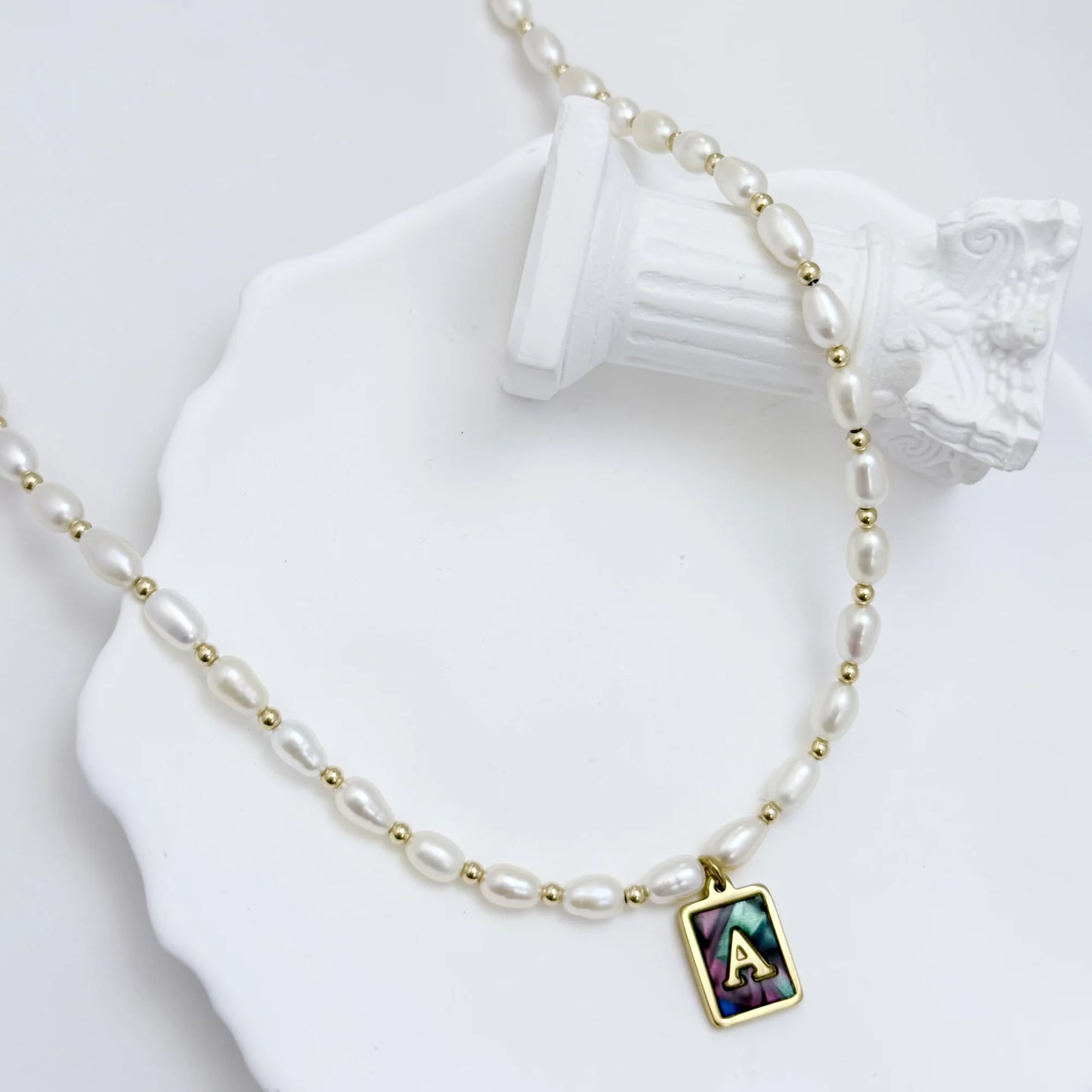 Premium freshwater rice pearl and 14K gold filled beaded necklace with personalised abalone shell initial charm, hand-finished in Australia