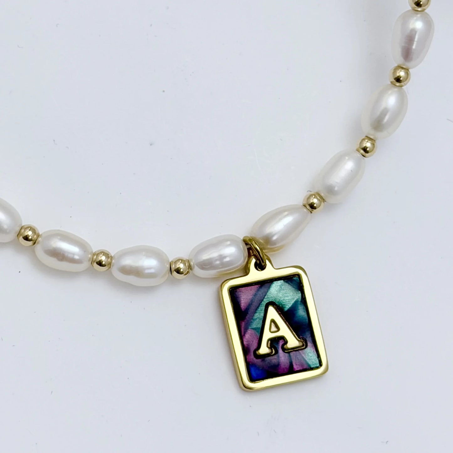 Premium freshwater rice pearl and 14K gold filled beaded necklace with personalised abalone shell initial charm, hand-finished in Australia