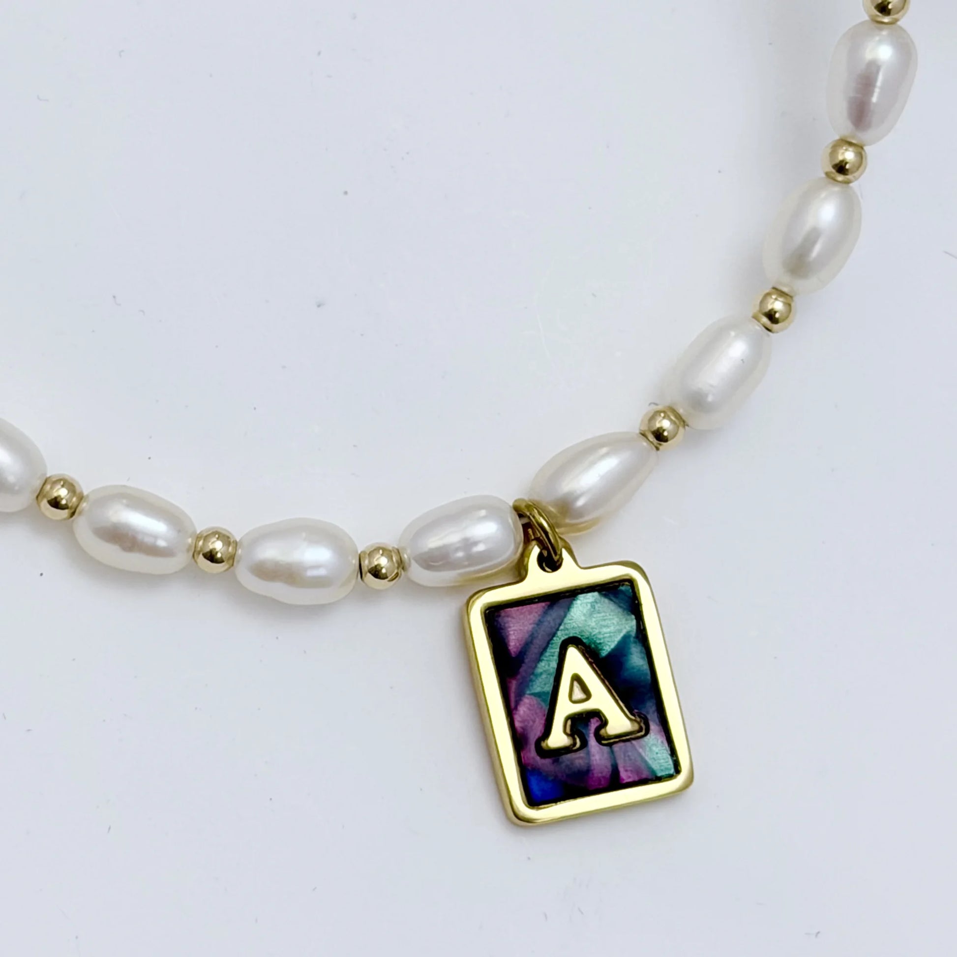 Premium freshwater rice pearl and 14K gold filled beaded necklace with personalised abalone shell initial charm, hand-finished in Australia