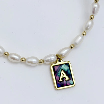 Premium freshwater rice pearl and 14K gold filled beaded necklace with personalised abalone shell initial charm, hand-finished in Australia