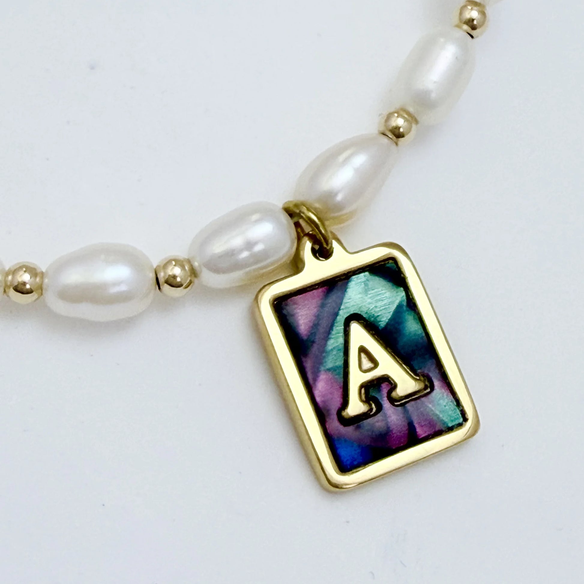 Premium freshwater rice pearl and 14K gold filled beaded necklace with personalised abalone shell initial charm, hand-finished in Australia