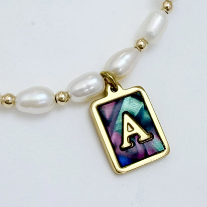 Premium freshwater rice pearl and 14K gold filled beaded necklace with personalised abalone shell initial charm, hand-finished in Australia