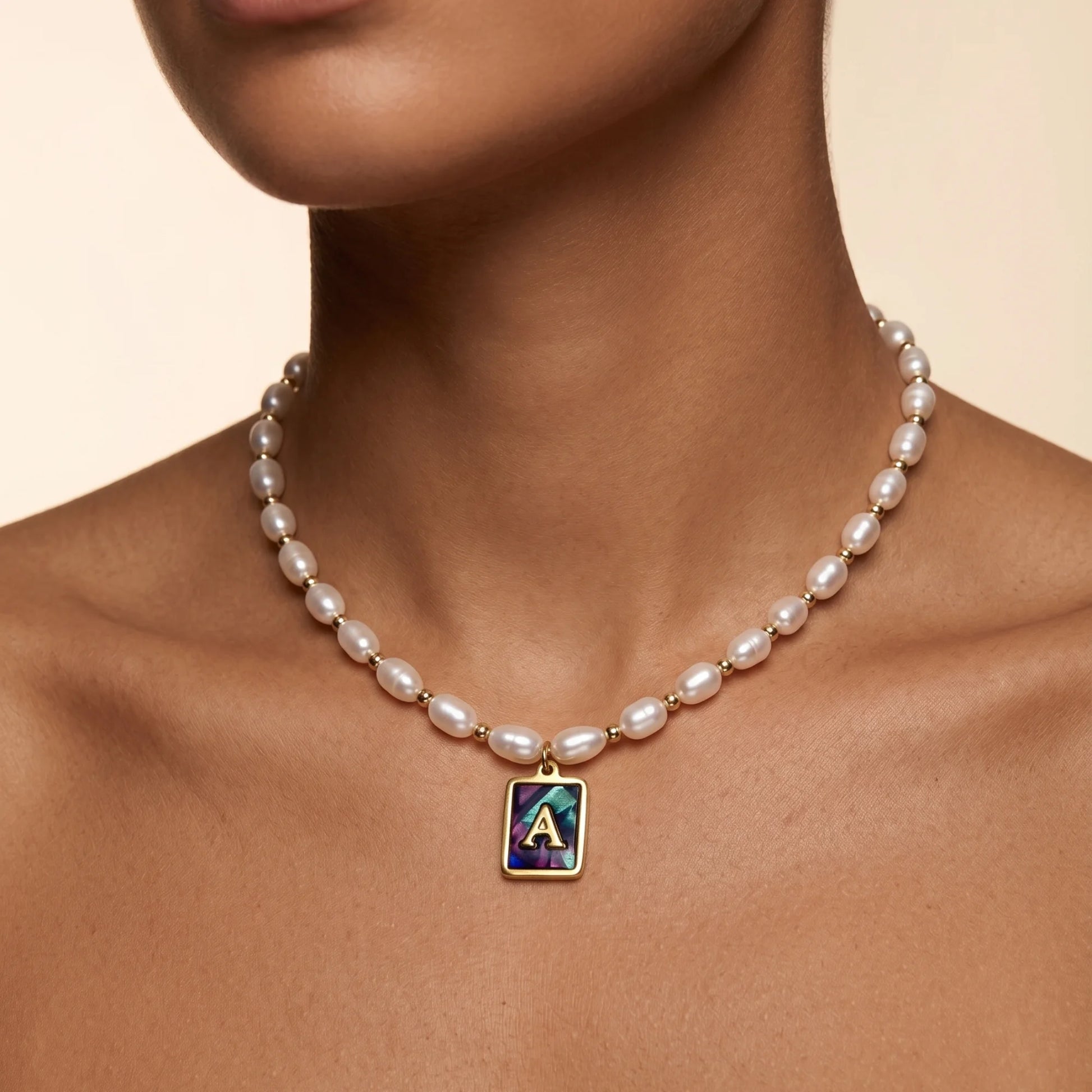 Premium freshwater rice pearl and 14K gold filled beaded necklace with personalised abalone shell initial charm, hand-finished in Australia
