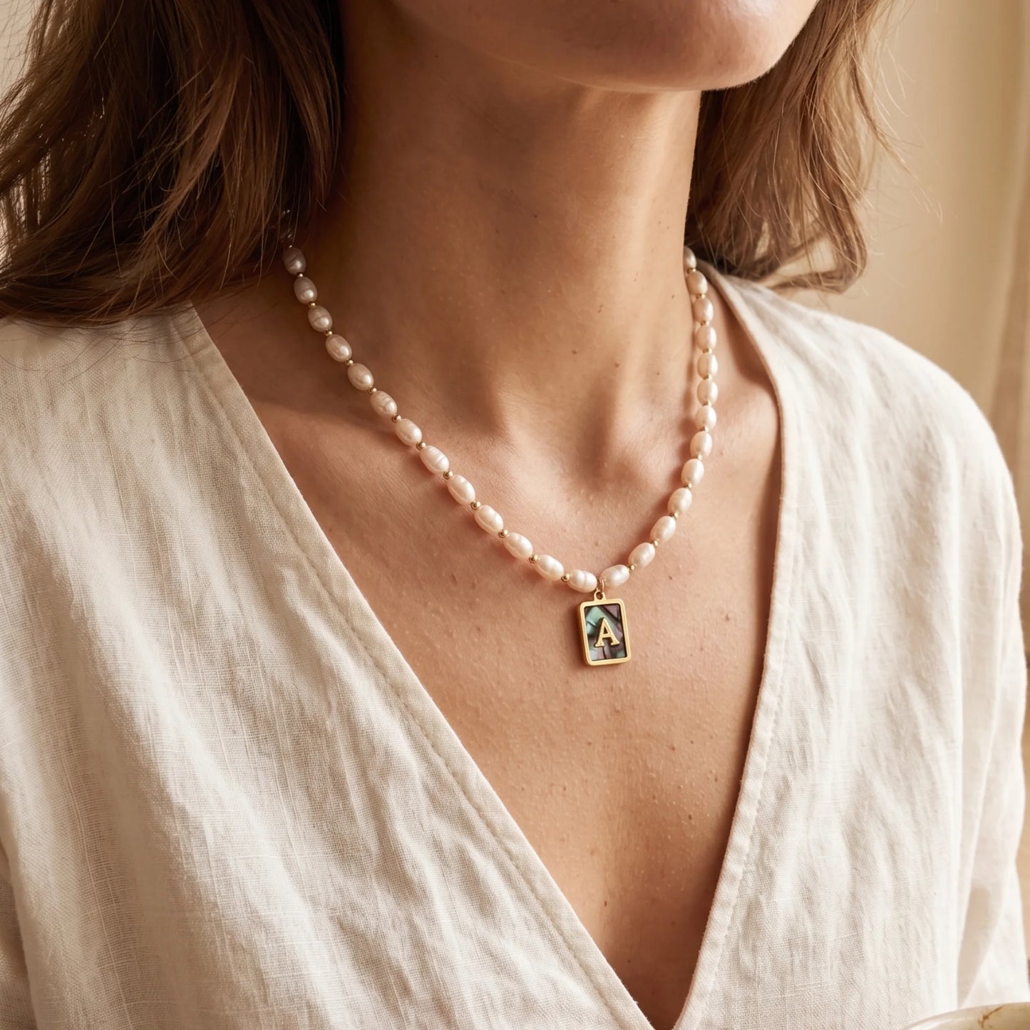 Premium freshwater rice pearl and 14K gold filled beaded necklace with personalised abalone shell initial charm, hand-finished in Australia