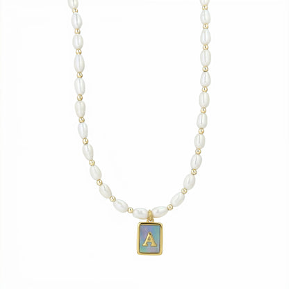 Premium freshwater rice pearl and 14K gold filled beaded necklace with personalised blue mother of shell initial charm, hand-finished in Australia