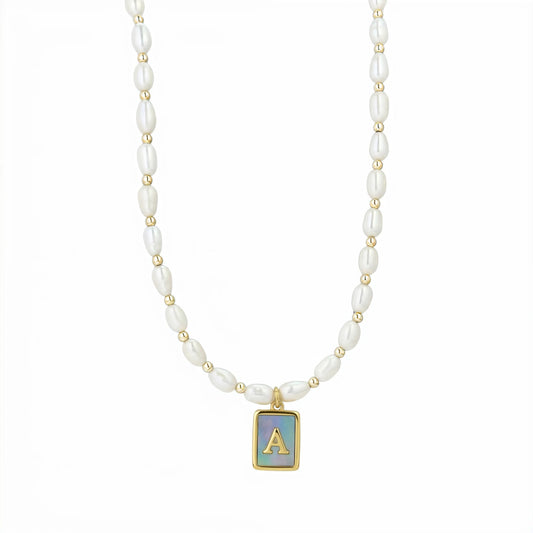 Premium freshwater rice pearl and 14K gold filled beaded necklace with personalised blue mother of shell initial charm, hand-finished in Australia