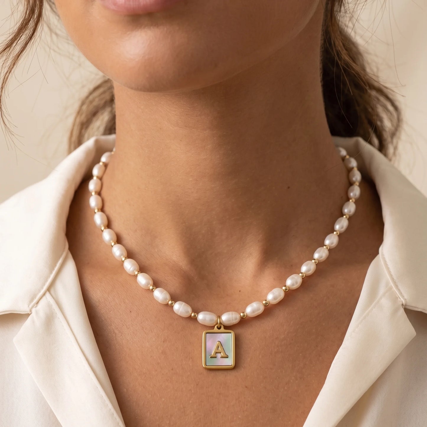 Premium freshwater rice pearl and 14K gold filled beaded necklace with personalised blue mother of shell initial charm, hand-finished in Australia