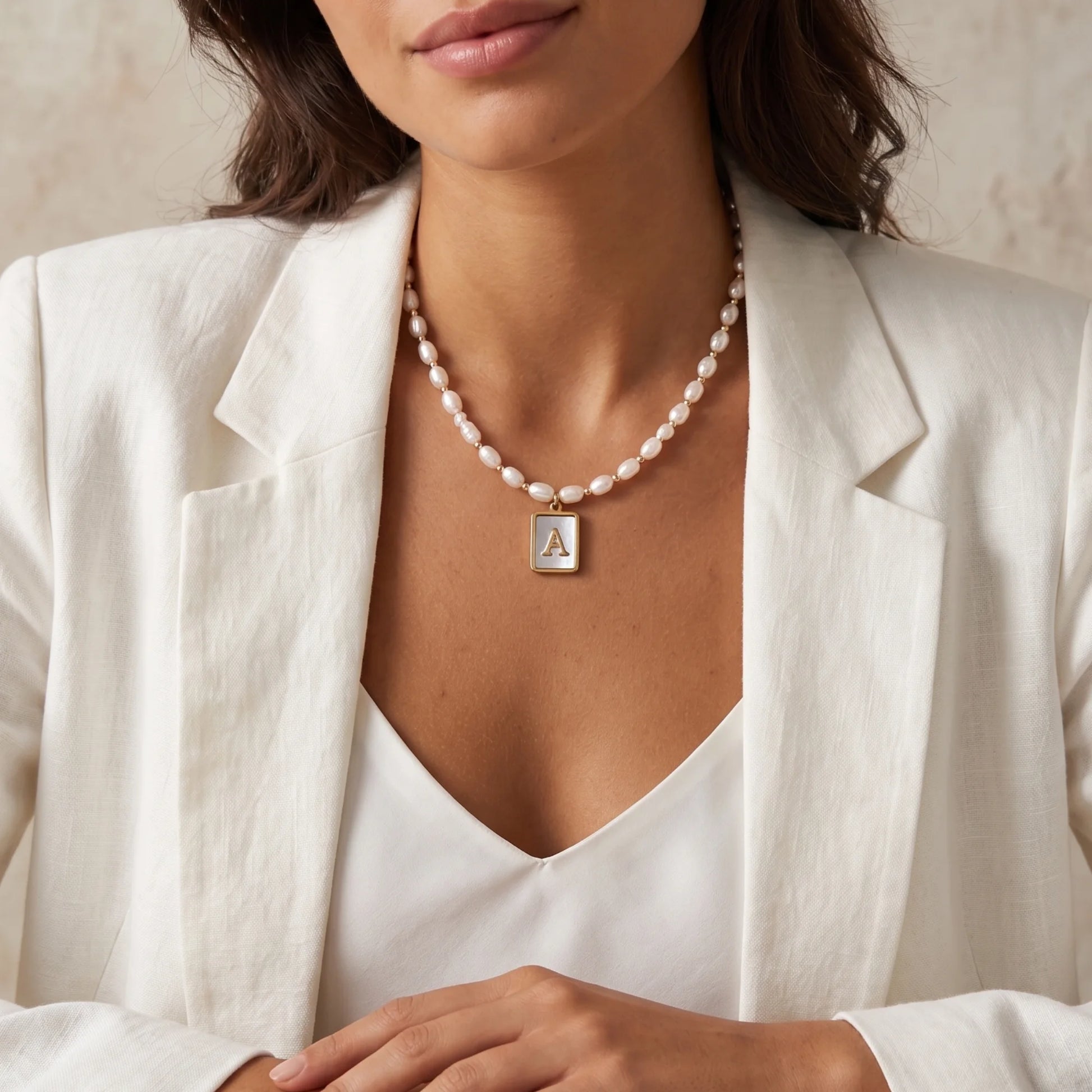 Premium freshwater rice pearl and 14K gold filled beaded necklace with personalised blue mother of shell initial charm, hand-finished in Australia